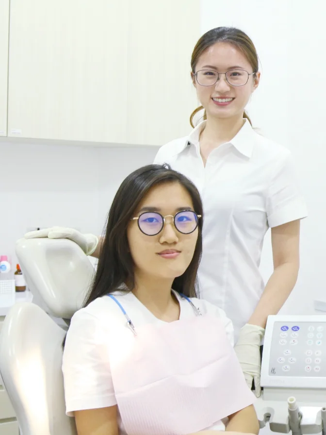 A NoFrills Dental clinician with a patient in a treatment room